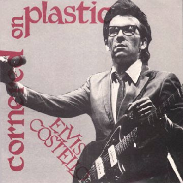ELVIS COSTELLO - CORNERED ON PLASTIC (COLOR) 7"